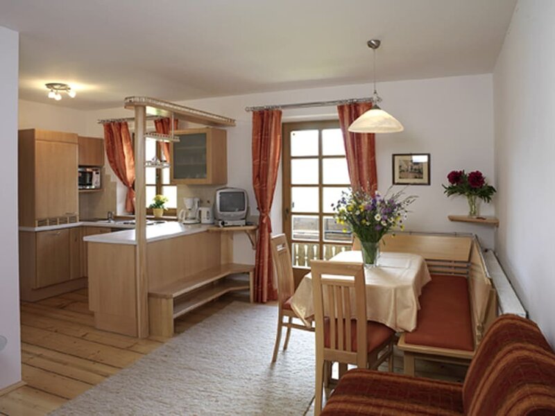 Living room with kitchen, corner seating, lounge furniture and satellite TV