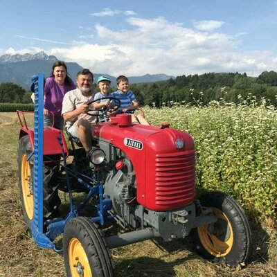 Joyfully on the small tractor