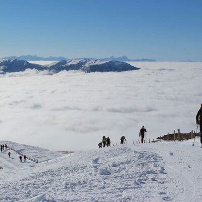 start to a ski tour above the clouds