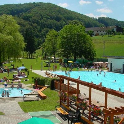 The Rabenstein outdoor swimming pool even offers the chance to swim in the river - you can see the Karhof in the background