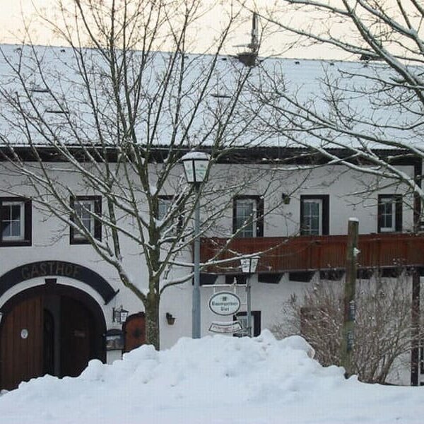 Farmhouse covered in snow