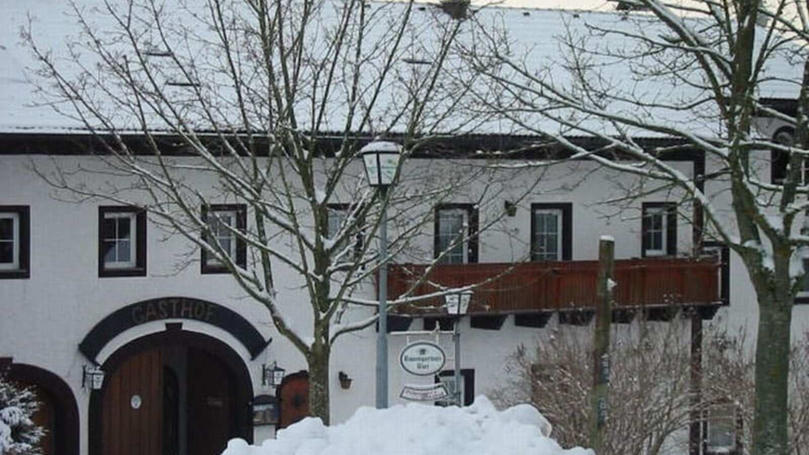 Farmhouse covered in snow