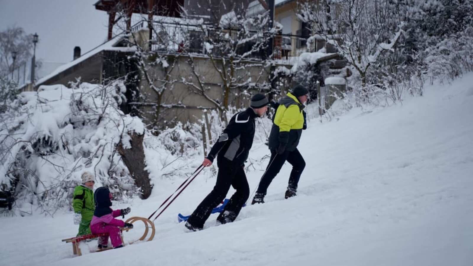 Having fun sledding in the snow