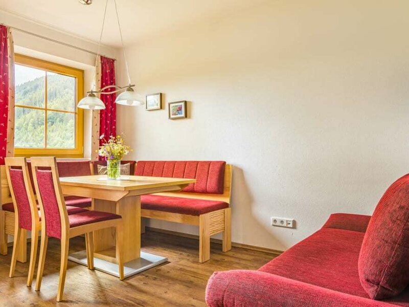 Dining table group with couch in the apartment