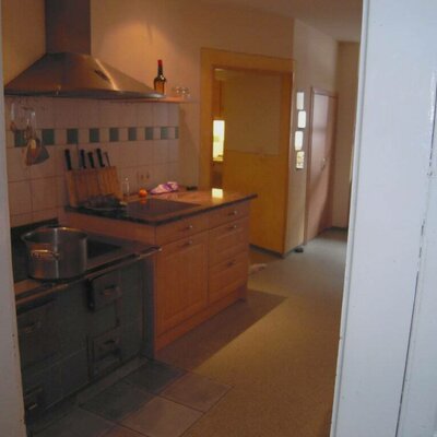 Kitchen with renovated wood-burning stove