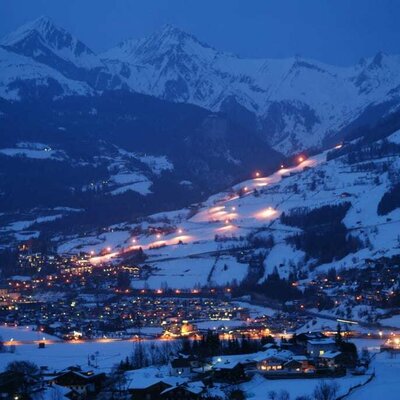 View from the house of Matrei by night with illuminated ski piste