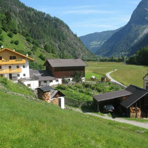 View from the south (an overall view of the farm): Smoke house, heated garage, private chapel, farm buildings, overlooking the valley and meadows in Umhausen and behind the ski and hiking area of Hochötz.